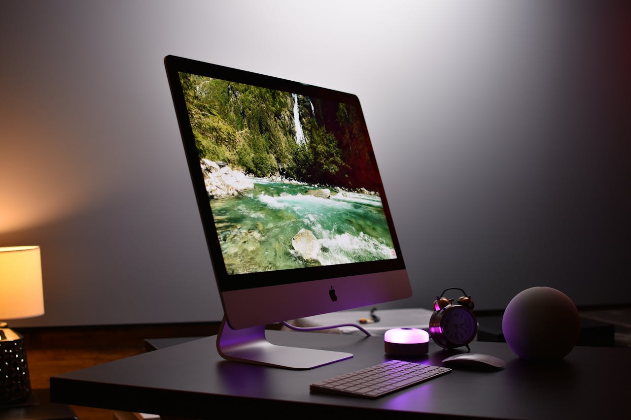 Stylish indoor workspace featuring a sleek desktop computer setup with accessories, ideal for productivity.